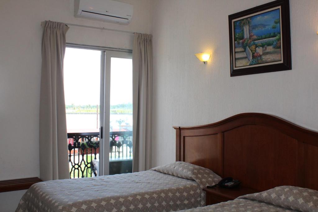 Двухместный (Двухместный номер с 2 отдельными кроватями) отеля Posada Doña Lala, Тлакотальпан