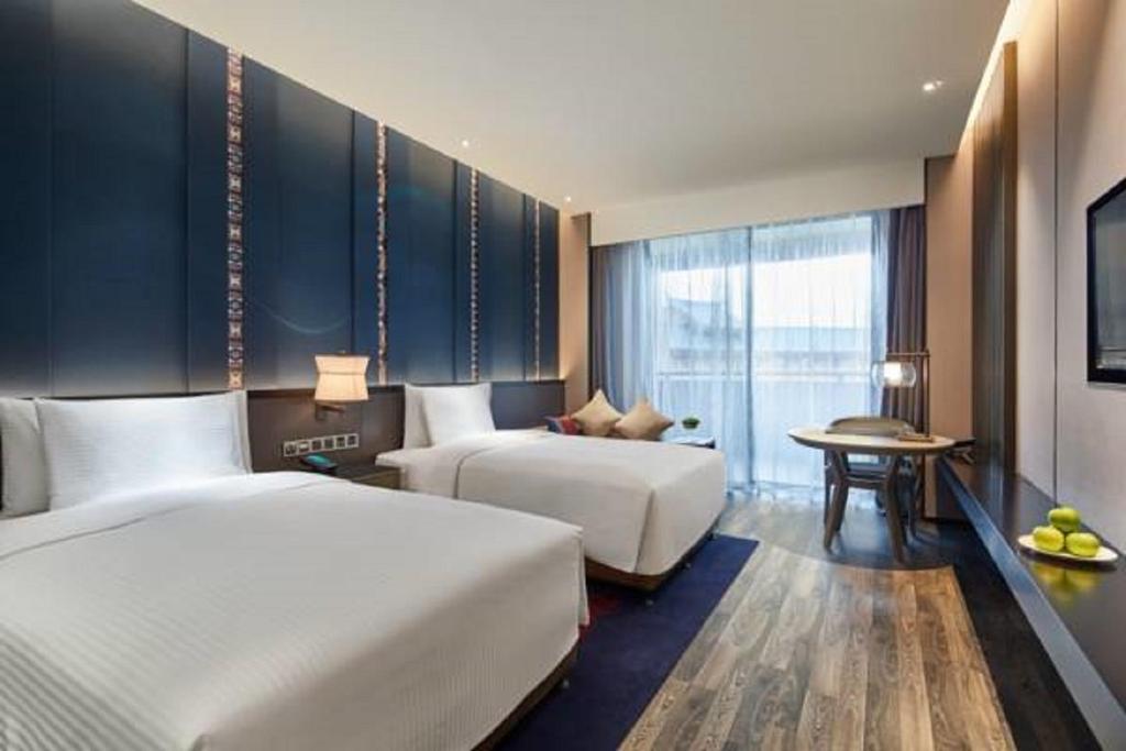 Двухместный (Представительский двухместный номер с 2 отдельными кроватями) отеля Wanda Realm Resort Nanning, Наньнин