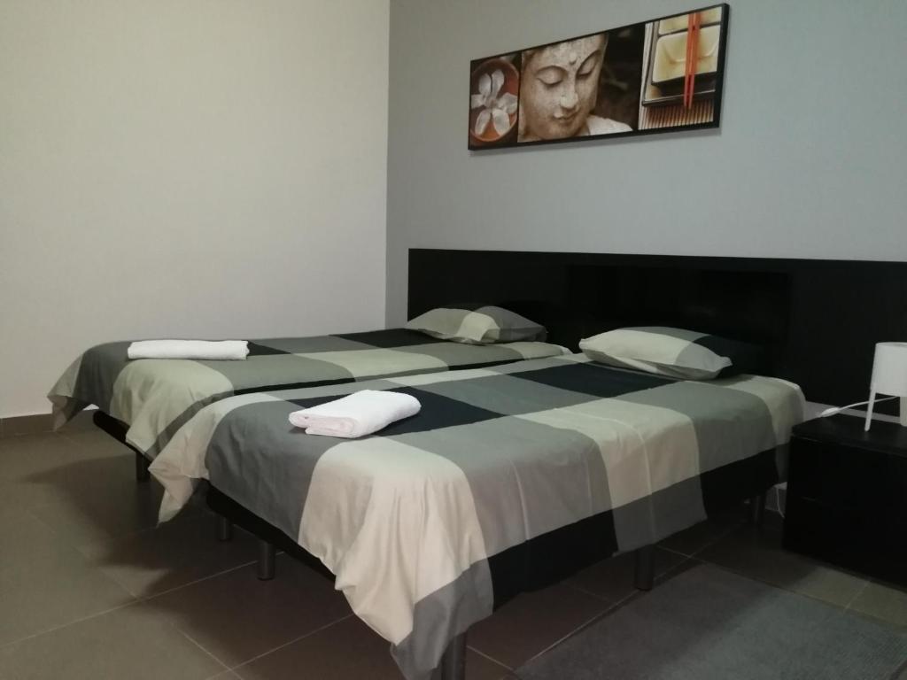 Двухместный (Улучшенный двухместный номер с 2 отдельными кроватями) гостевого дома Lagos City Center Guest House & Hostel, Лагуш