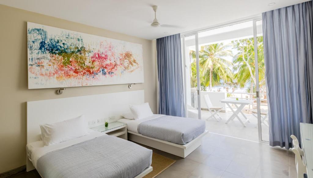 Двухместный (Улучшенный двухместный номер с 1 кроватью и видом на море) отеля Taru Villas - The Tangalle Social, Тангалла