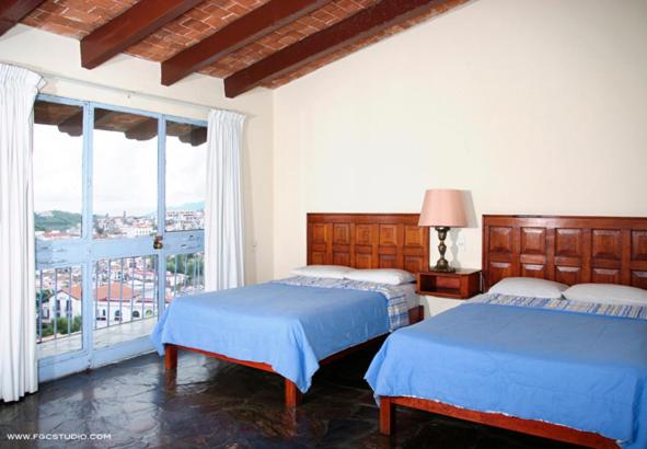 Двухместный (Двухместный номер с 2 двуспальными кроватями) отеля Hotel De La Borda, Таско-де-Аларкон