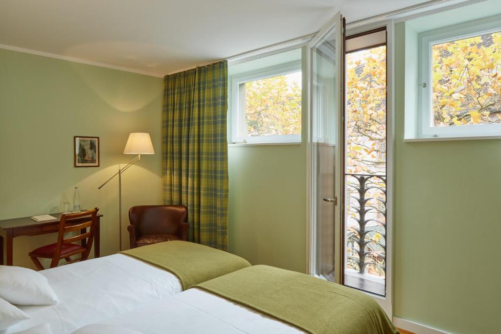 Двухместный (Двухместный номер эконом-класса с 2 отдельными кроватями) отеля hotel brasserie au violon, Базель