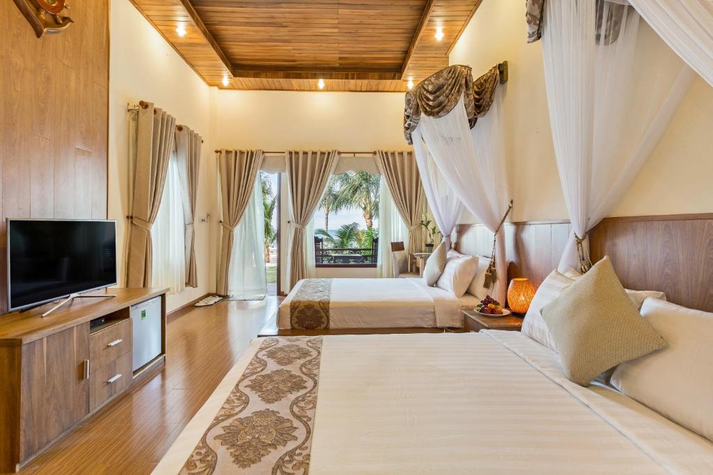 Двухместный (Двухместный номер Делюкс с 2 отдельными кроватями с видом на пляж) курортного отеля Gold Coast Resort Phu Quoc, Дуонг-Донг