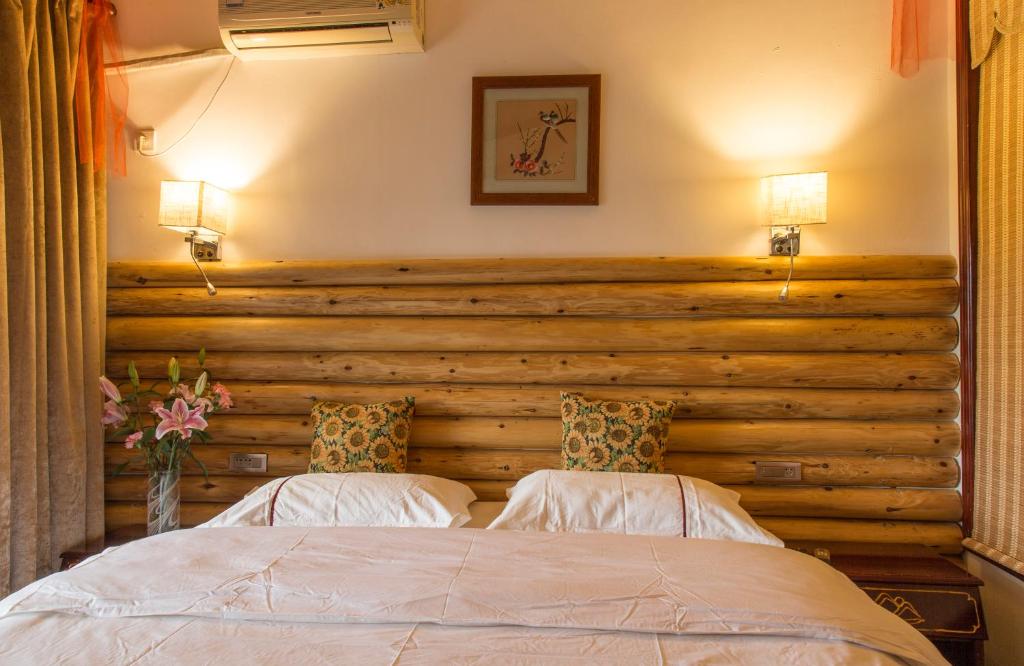 Двухместный (Номер Делюкс с кроватью размера «queen-size») отеля Snow Lion Riverside Resort, Яншо