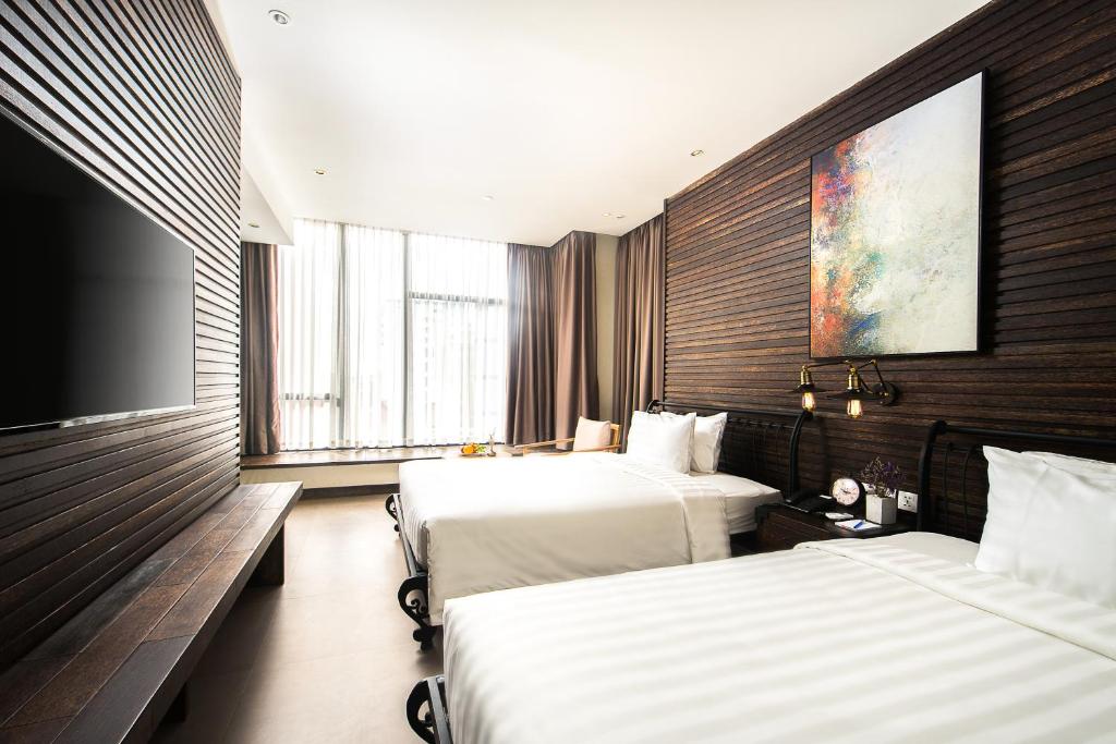 Двухместный (Улучшенный двухместный номер с 2 отдельными кроватями) отеля EMAN-SIM BOUTIQUE HOTEL, Пномпень