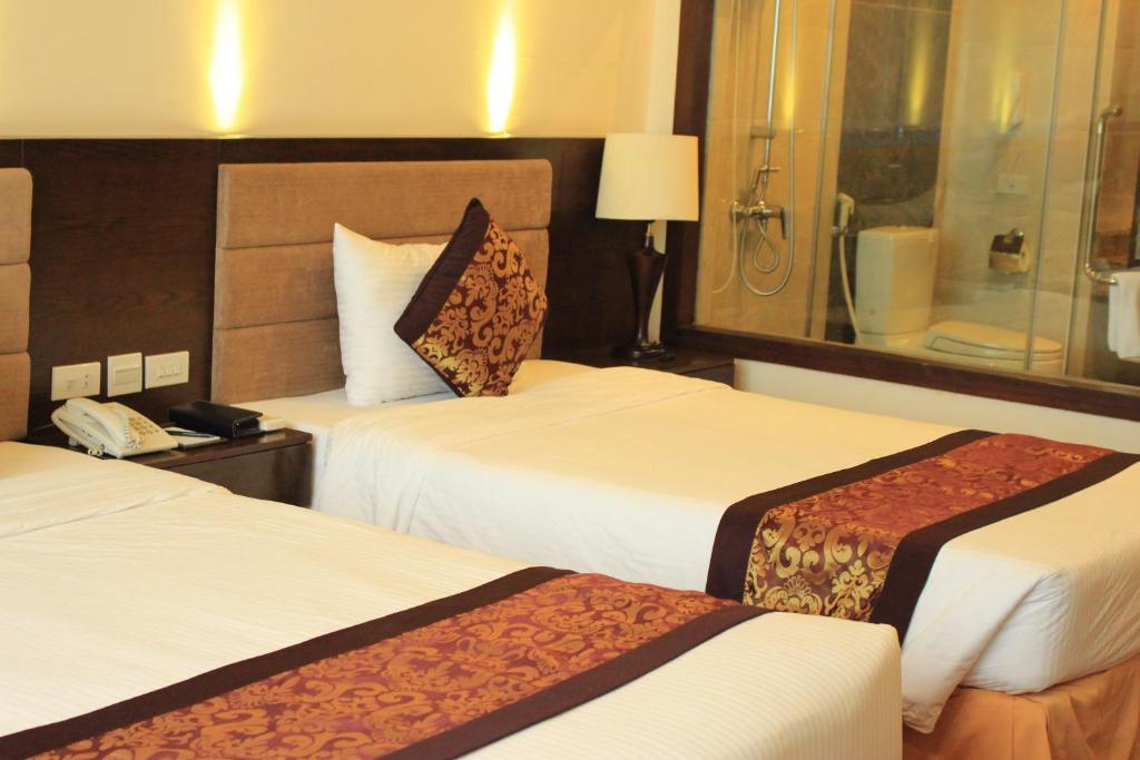 Двухместный (Двухместный номер Делюкс с 2 отдельными кроватями) отеля Muong Thanh Holiday Quang Binh Hotel, Донгхой