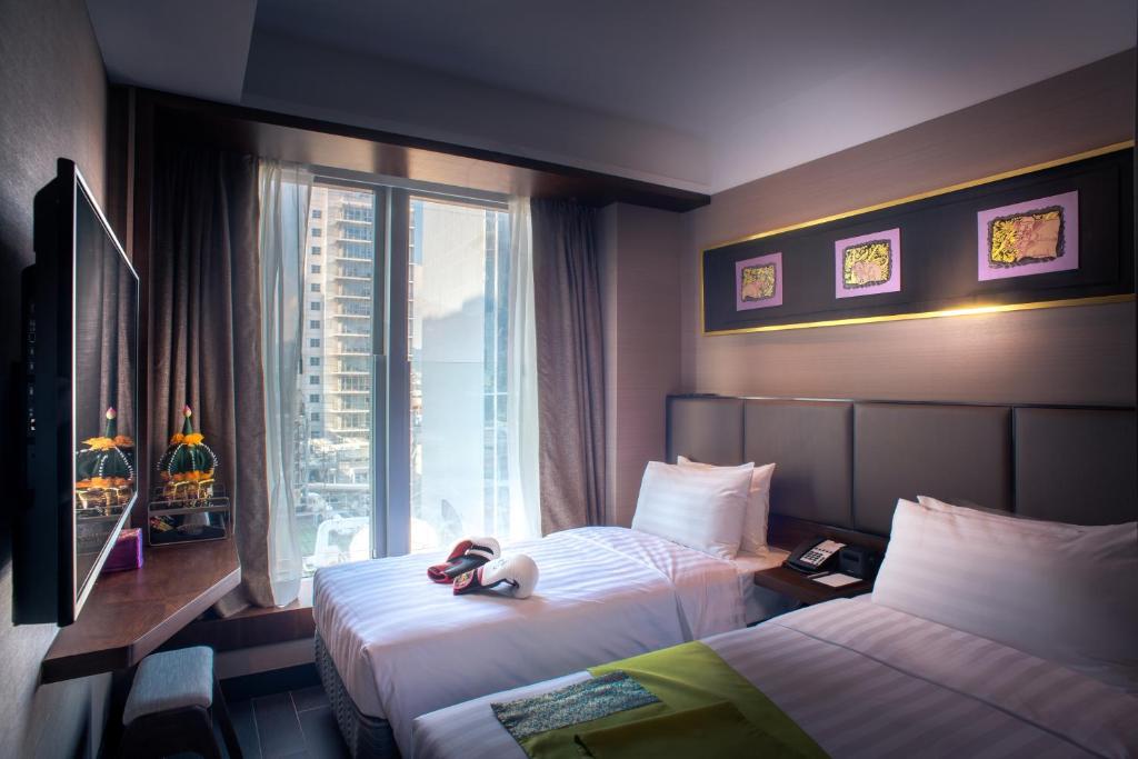Двухместный (Улучшенный двухместный номер с 2 отдельными кроватями) отеля Soravit on Granville, Гонконг (город)