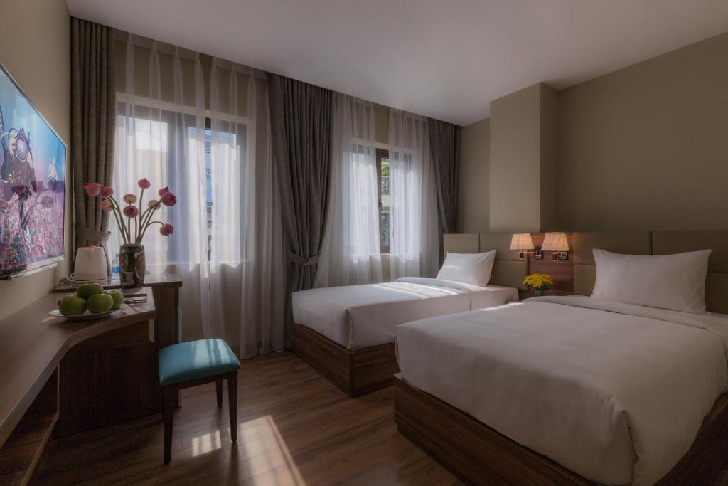 Двухместный (Представительский двухместный номер с 1 кроватью или 2 отдельными кроватями) отеля Lotus Boutique Hotel, Хошимин