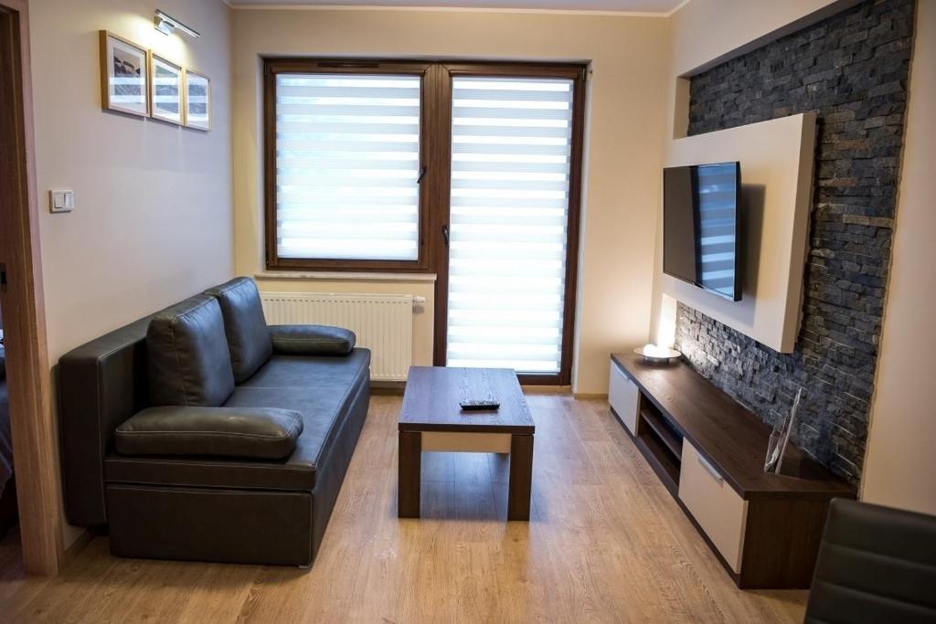 Апартаменты (One-Bedroom Apartment with Paid Garage) апартамента Apartamenty Sun&Snow Zielony Zdrój, Крыница
