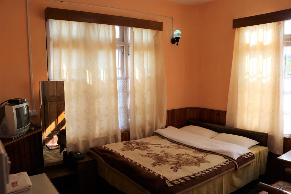 Двухместный (Двухместный номер Делюкс с 1 кроватью) отеля Deki Lodge, Калимпонг