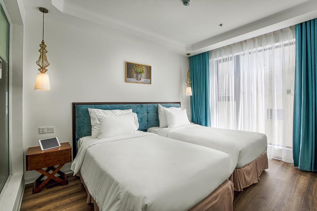 Двухместный (Двухместный номер Делюкс с 2 отдельными кроватями и частичным видом на океан) отеля Adaline Hotel and Suite, Дананг