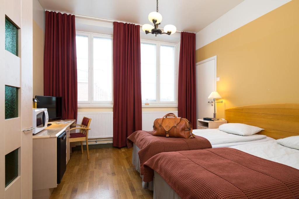 Двухместный (Двухместный номер с 2 отдельными кроватями) отеля Hotelli Ville, Тампере