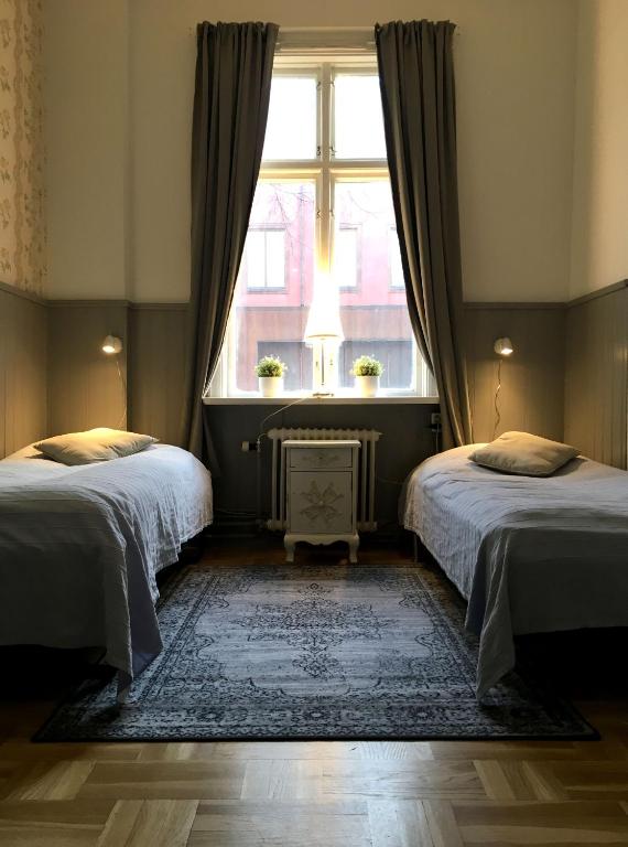 Двухместный (Двухместный номер с 2 отдельными кроватями и общей ванной комнатой) хостела Vandrarhem Uppsala Kungsängstorg, Уппсала