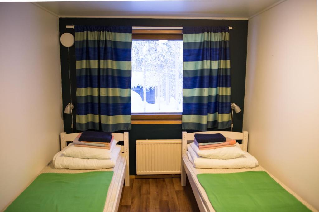 Номер (Спальное место в 2-местном общем номере для мужчин и женщин) хостела Kuerkievari KuerHostel, Акасломполо