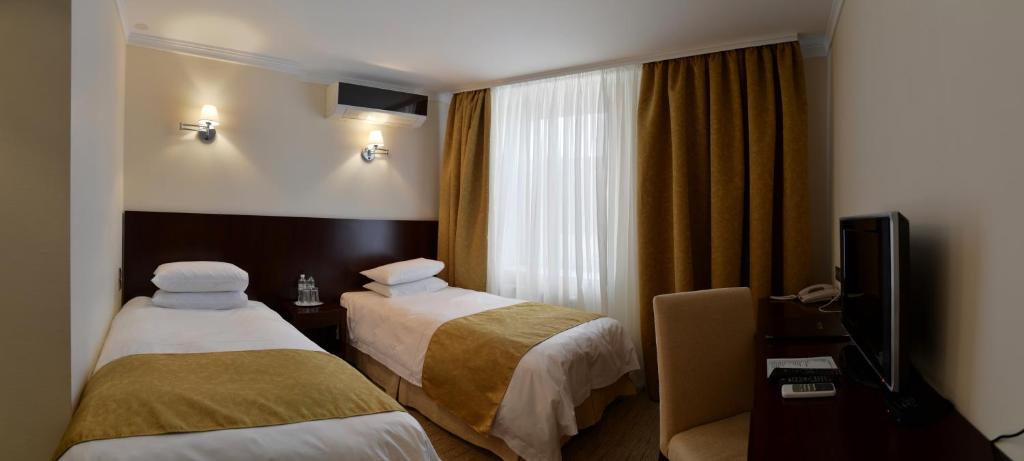 Двухместный (Специальное предложение - Стандартный двухместный номер с 2 отдельными кроватями) отеля Россия, Тирасполь