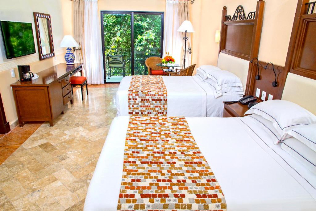 Двухместный (Двухместный номер с 1 кроватью (для 2 взрослых и 2 детей)) курортного отеля Occidental Cozumel All Inclusive, Косумель