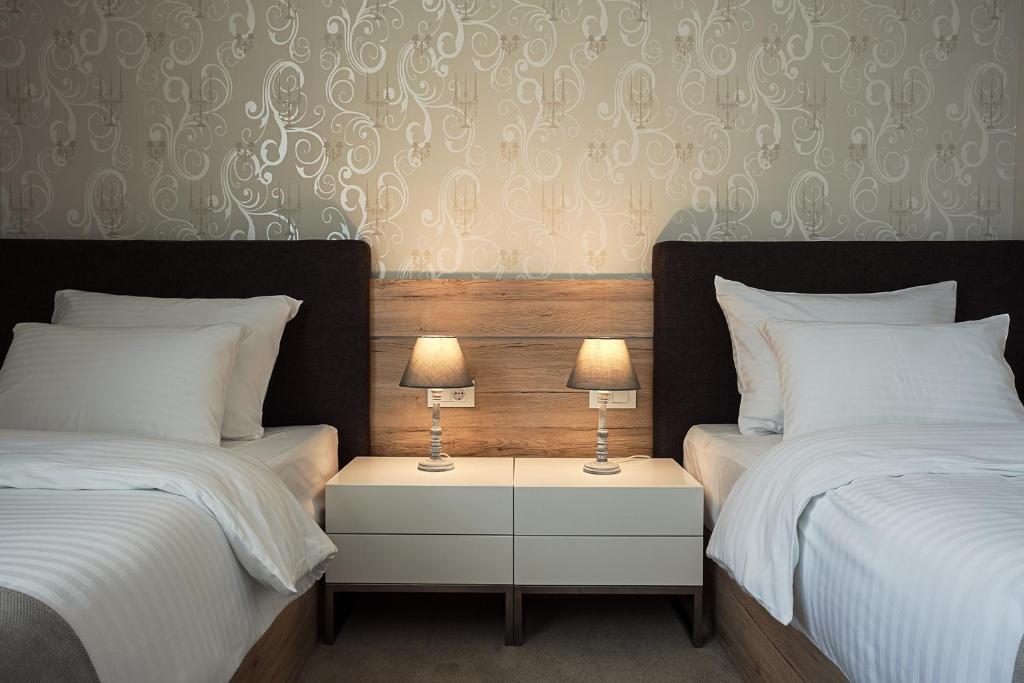 Двухместный (Двухместный номер Делюкс с 2 отдельными кроватями) отеля IG Hotel Garni, Горни Милановац