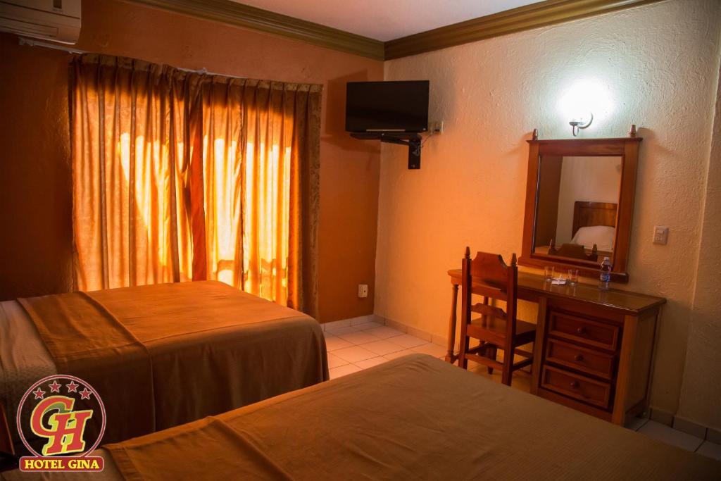 Четырехместный (Стандартный номер) отеля Hotel Gina, Текоман