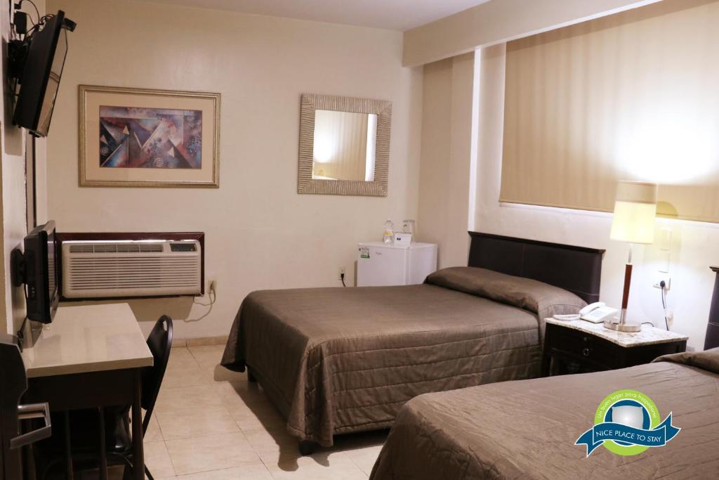 Двухместный (Двухместный номер с 2 двуспальными кроватями) отеля Hotel America Centro, Лос-Мочис