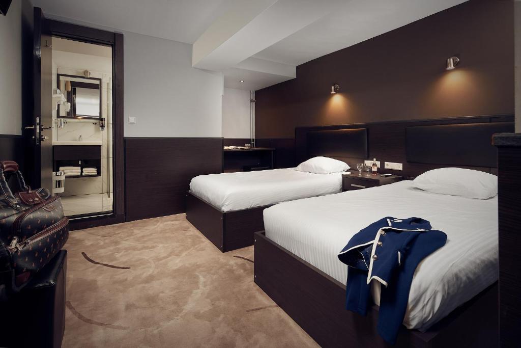 Двухместный (Двухместный номер с 2 отдельными кроватями (без окна)) отеля Belfort Hotel, Амстердам