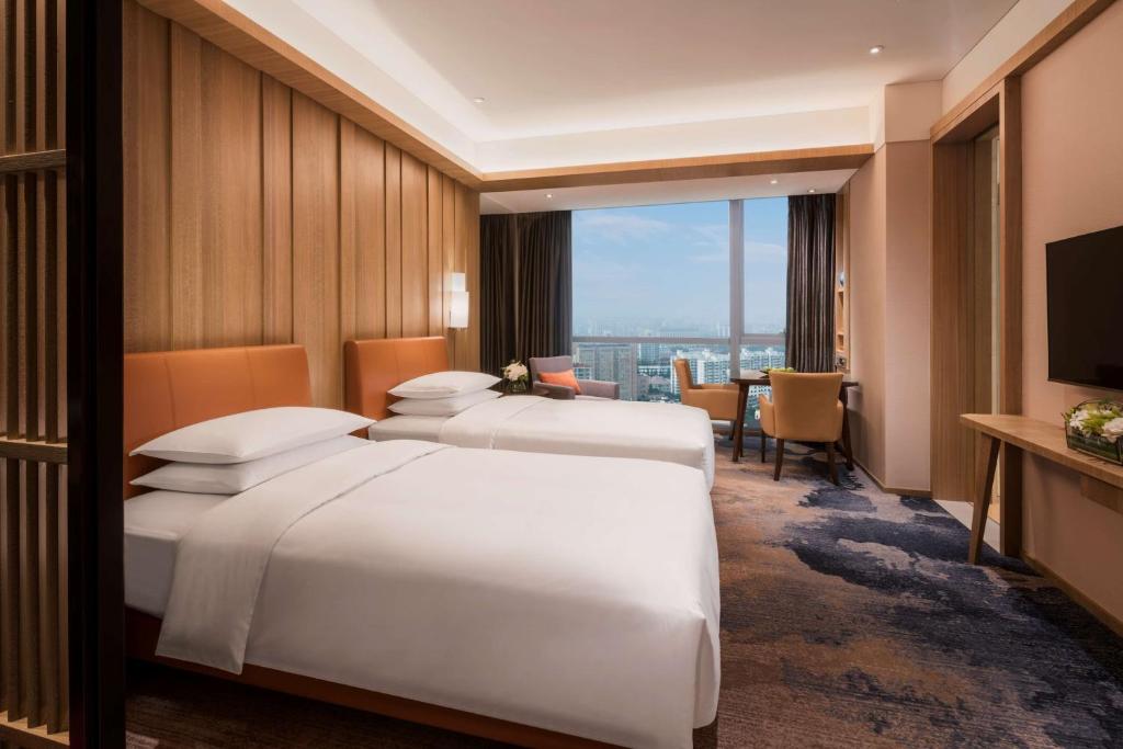 Двухместный (Двухместный номер с 2 отдельными кроватями) отеля Hyatt Regency Shanghai Wujiaochang, Шанхай