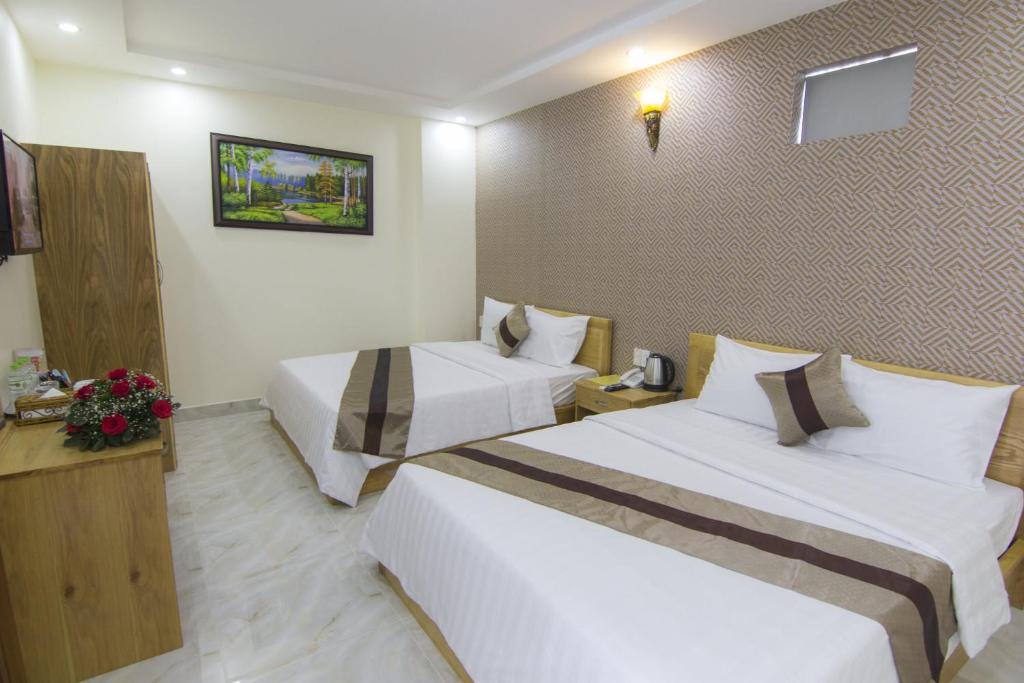Четырехместный (Улучшенный четырехместный номер) отеля Ngoc Hanh Beach Hotel, Вунгтау