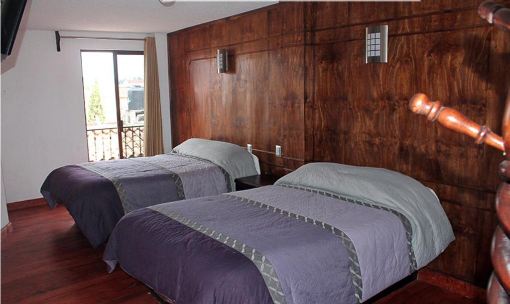 Двухместный (Двухместный номер Делюкс с 2 двуспальными кроватями) отеля Hotel Avenida, Сакатлан