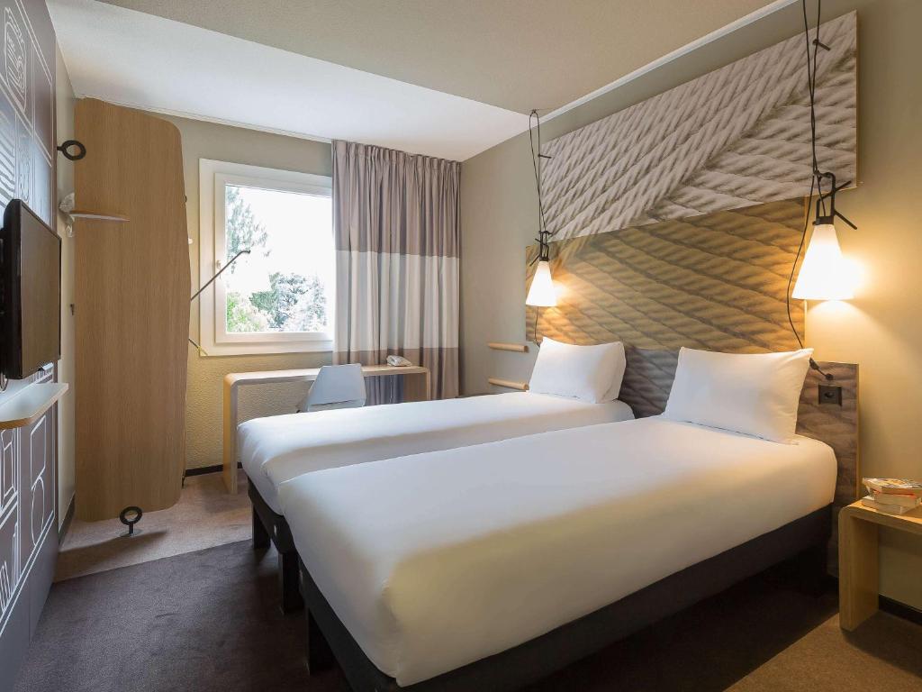 Двухместный (Стандартный двухместный номер с 2 отдельными кроватями) отеля ibis Genève Aéroport, Женева