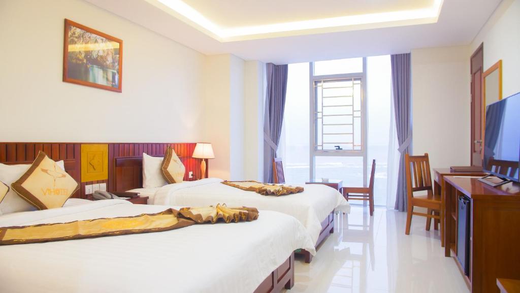 Двухместный (Двухместный номер с 2 отдельными кроватями и видом на море) отеля Vinh Hoang Hotel, Донгхой