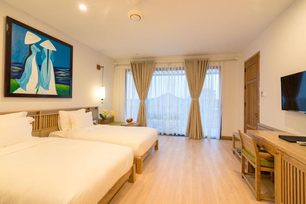 Двухместный (Двухместный номер Делюкс с 1 кроватью или 2 отдельными кроватями и балконом) отеля ZEN Boutique Hoi An, Хойан
