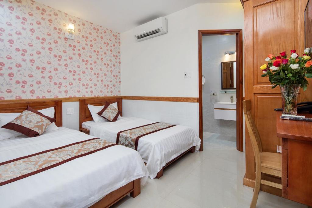Двухместный (Стандартный двухместный номер с 2 отдельными кроватями) отеля Nhat Minh Anh Hotel, Хошимин