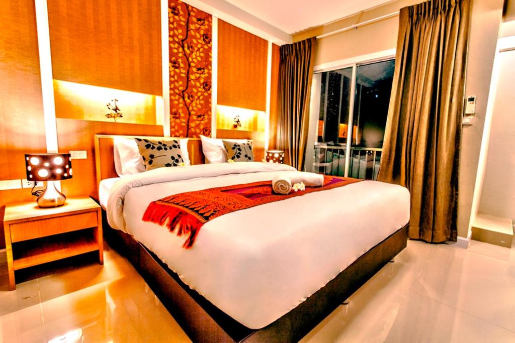 Двухместный (Улучшенный двухместный номер с 1 кроватью или 2 отдельными кроватями) отеля The Aim Sathorn Hotel, Бангкок