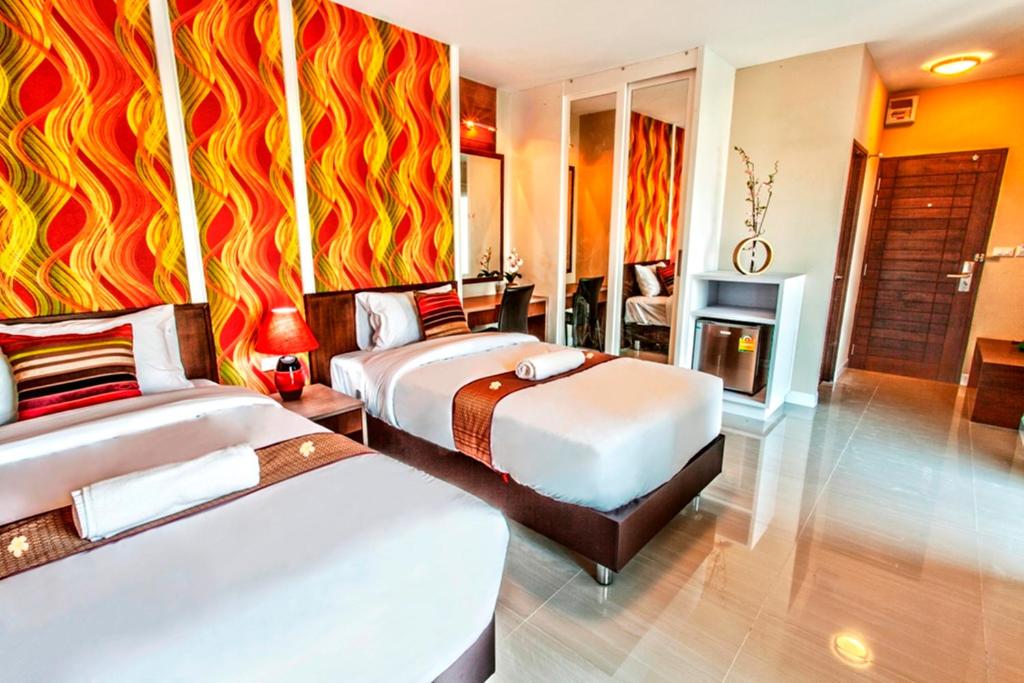 Двухместный (Двухместный номер Делюкс с 2 отдельными кроватями) отеля The Aim Sathorn Hotel, Бангкок