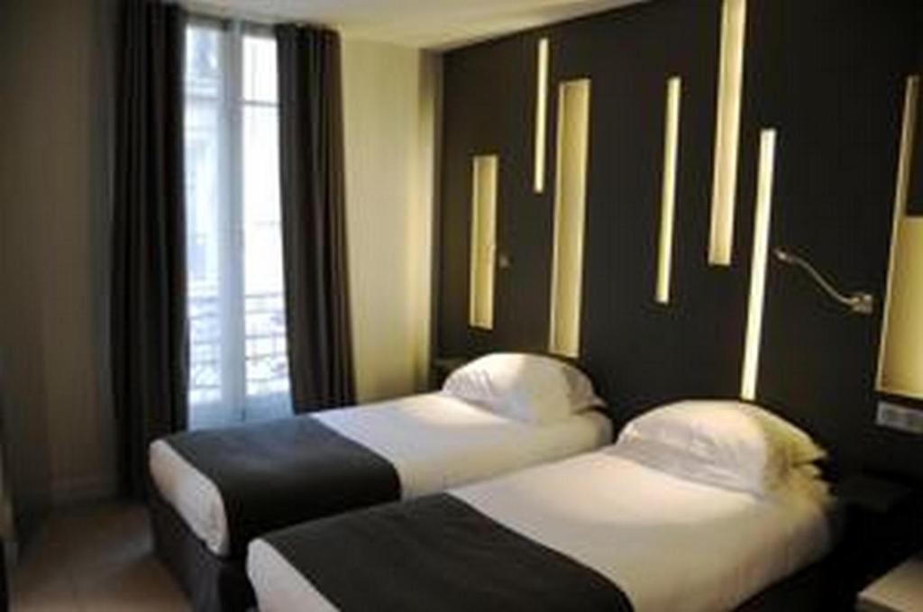 Двухместный (Классический двухместный номер с 2 отдельными кроватями) отеля Arc de Triomphe Etoile, Париж