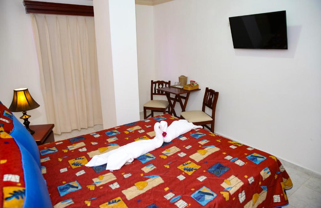 Сьюит (Улучшенный люкс) отеля Hotel Los Jardines, Сантьяго-де-лос-Кабальерос