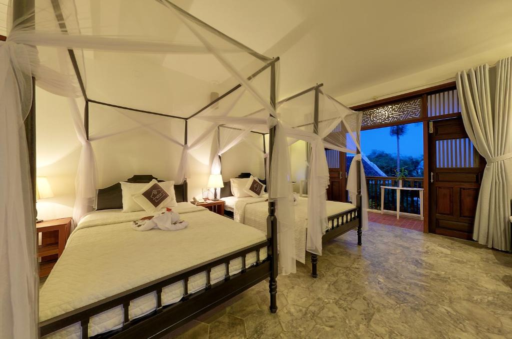 Двухместный (Двухместный номер «Гранд» Делюкс с 1 кроватью или 2 отдельными кроватями и балконом) курортного отеля Hoi An Ancient House Resort & Spa, Хойан
