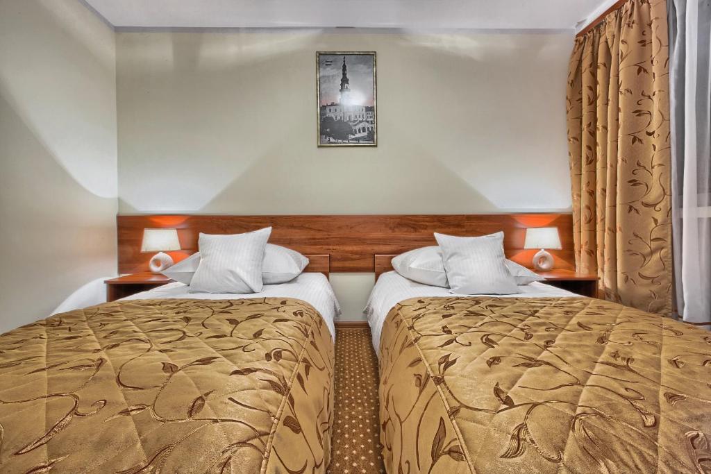 Двухместный (Стандартный двухместный номер с 2 отдельными кроватями) отеля Hotel Renesans Замосць
