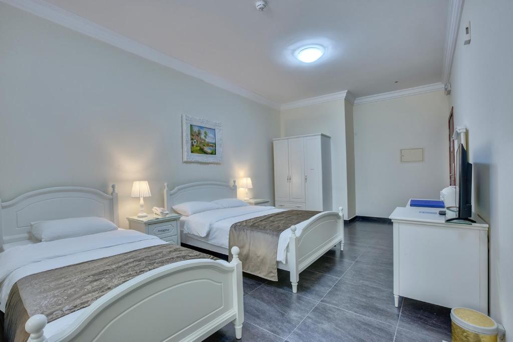 Двухместный (Двухместный номер с двуспальной кроватью и дополнительной кроватью) отеля Royal Hotel, Шарджа