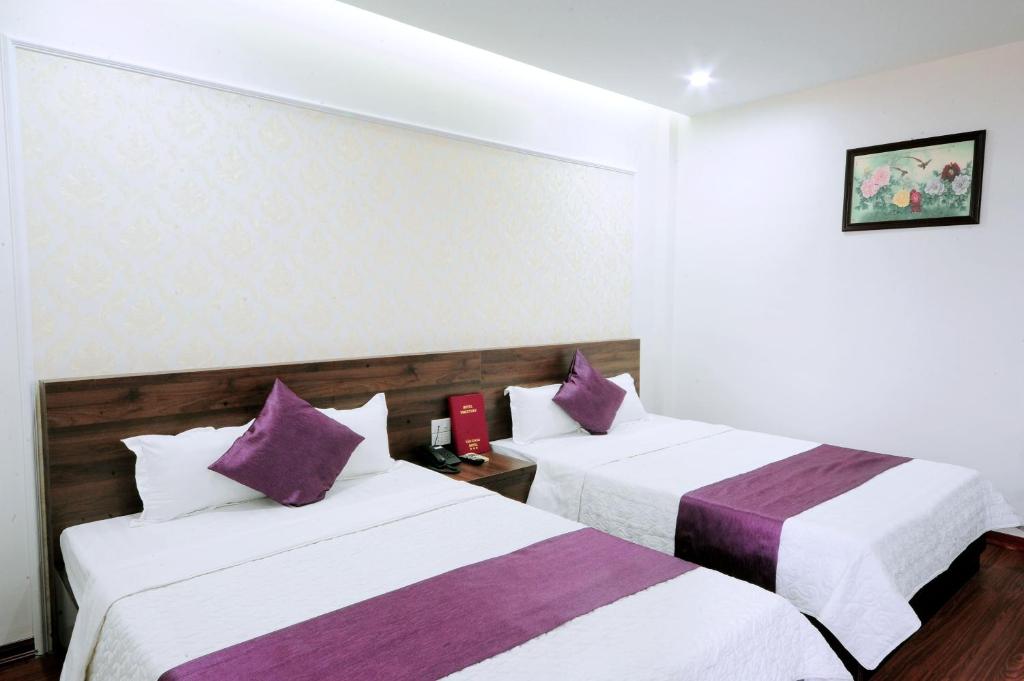 Двухместный (Двухместный номер Делюкс с 2 двуспальными кроватями) отеля Van Giang Hotel, Ниньбинь