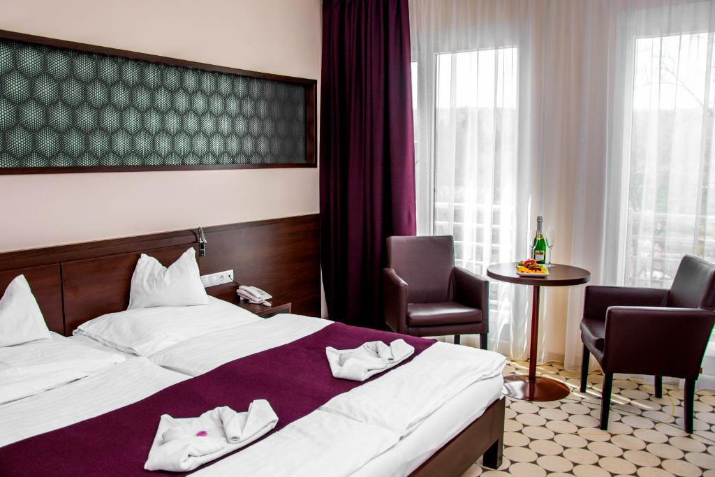 Двухместный (Двухместный номер с 1 кроватью или 2 отдельными кроватями) отеля Hotel Aurora, Мишкольц-Тапольца