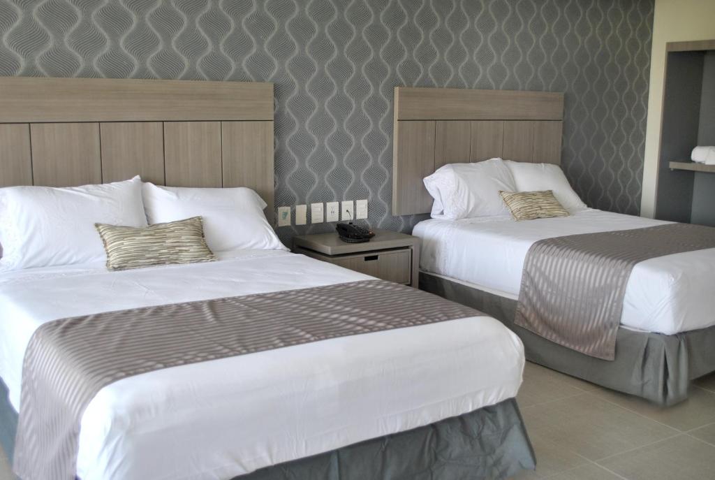 Двухместный (Двухместный номер с 2 отдельными кроватями и видом на озеро) отеля Hotel Infinity, Текескитенго