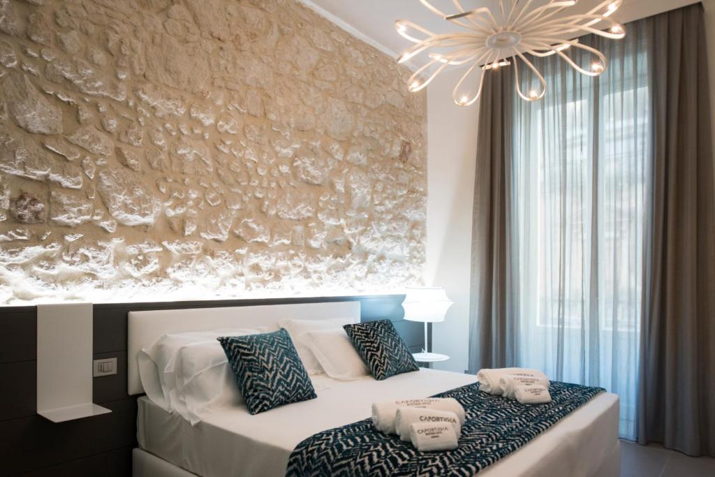 Двухместный (Улучшенный двухместный номер с 1 кроватью или 2 отдельными кроватями) отеля Caportigia Boutique Hotel, Сиракузы