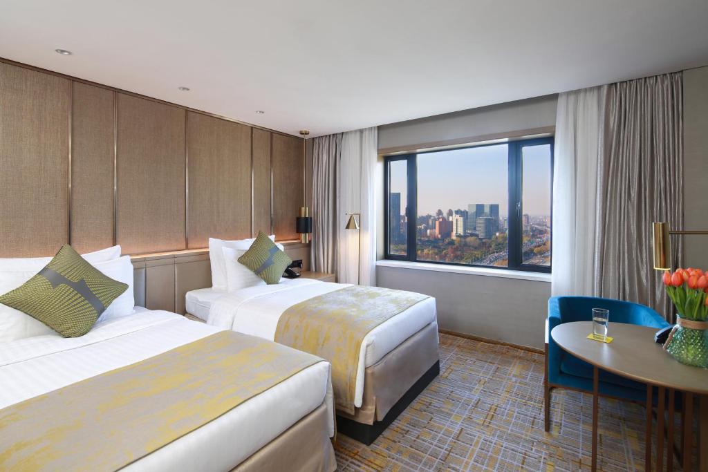 Двухместный (Двухместный номер «Гранд» Делюкс с 2 отдельными кроватями) отеля Jin Jiang Rainbow Hotel, Шанхай