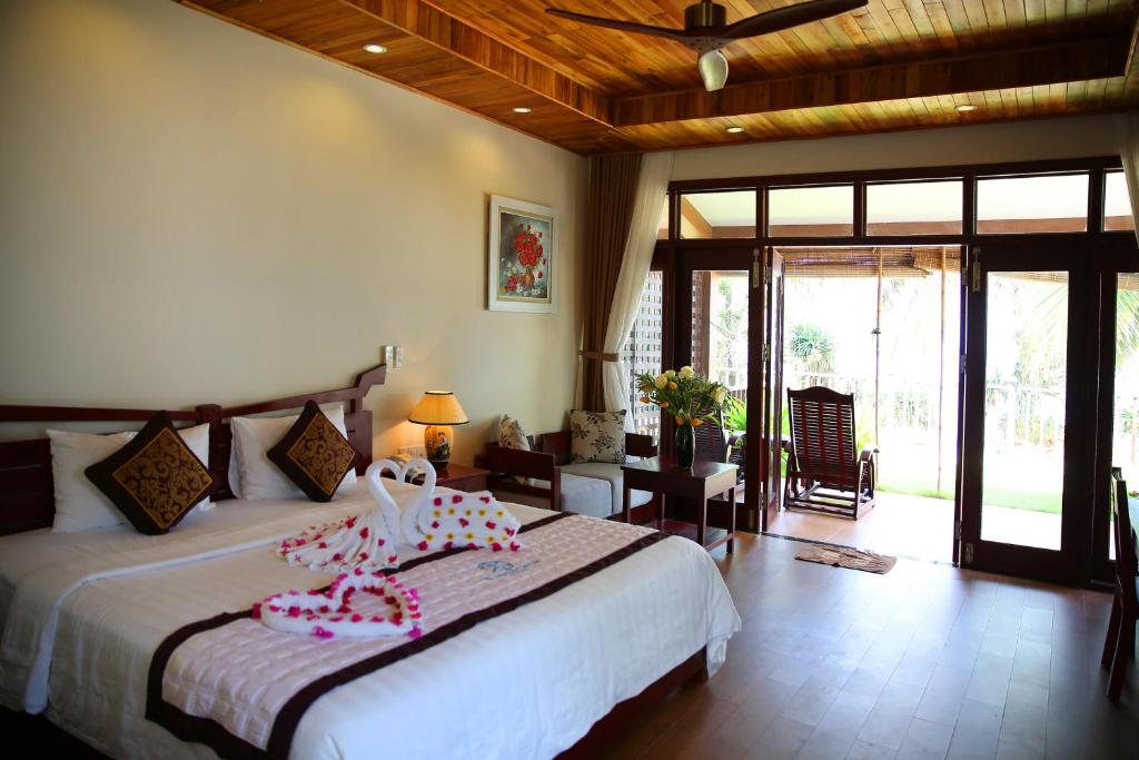 Сьюит (Двухместный номер на берегу моря с 1 кроватью) курортного отеля Tropicana Resort Phu Quoc, Дуонг-Донг