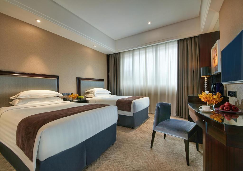 Двухместный (Двухместный номер бизнес-класса с 2 отдельными кроватями) отеля Shanghai New Century Manju Hotel Luoshan @SNIEC, Шанхай