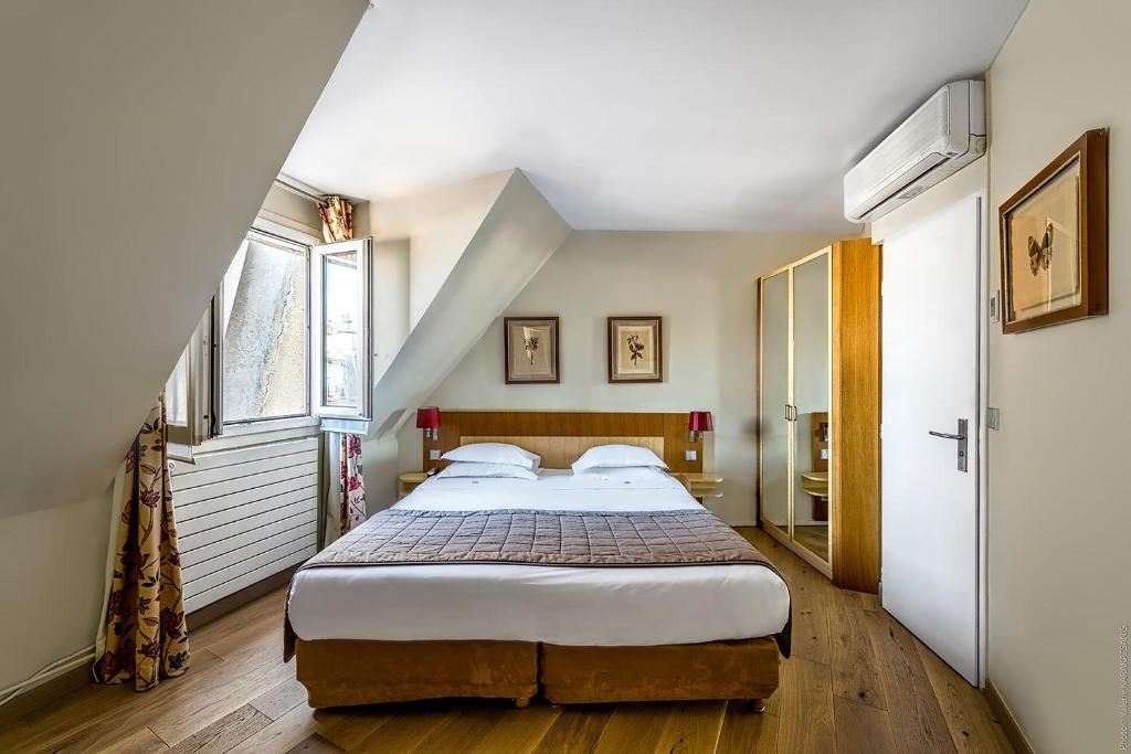 Двухместный (Двухместный номер с 1 кроватью и видом на крыши (для 1 или 2 человек)) отеля Etoile Park Hotel, Париж
