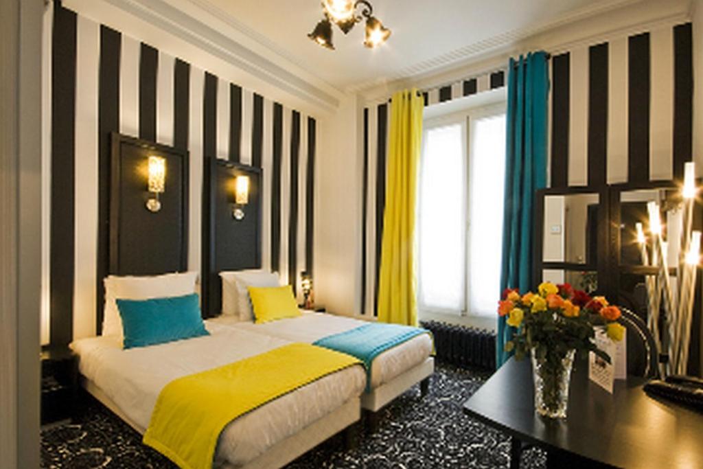 Двухместный (Улучшенный двухместный номер с 1 кроватью или 2 отдельными кроватями) отеля Hotel Peyris Opera, Париж