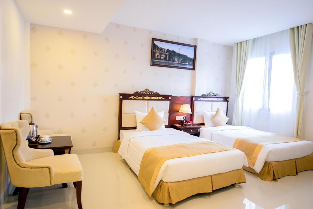 Двухместный (Улучшенный двухместный номер с 2 отдельными кроватями) отеля Le Saigon Hotel, Хошимин