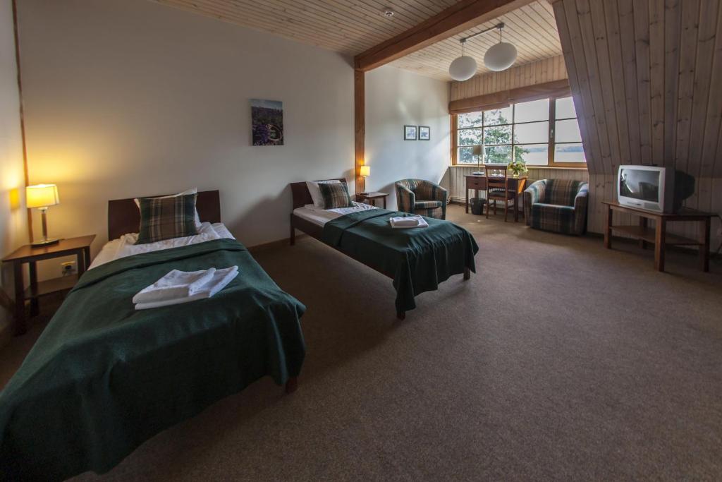 Двухместный (Улучшенный двухместный номер с 2 отдельными кроватями) отеля Porto Resort, Саулкрасты