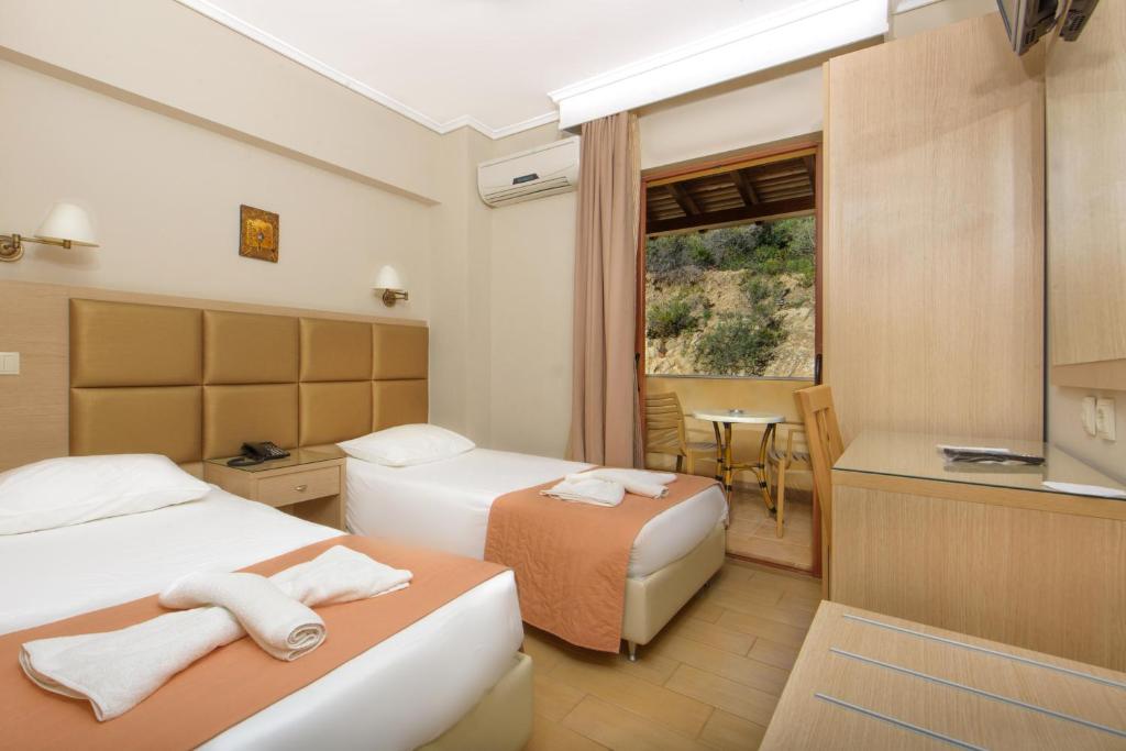 Двухместный (Бюджетный двухместный номер с 2 отдельными кроватями) отеля Ouranoupolis Princess, Уранополис
